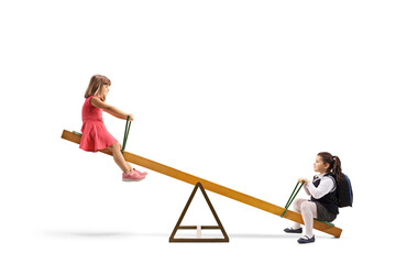 Canvas Print - Two girls playing on a seesaw