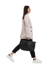 Canvas Print - Beautiful businesswoman in suit with briefcase walking on white background