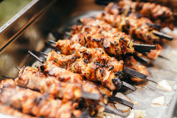 Wall Mural - Marinated shashlik lies cooked on a barbecue grill. Shashlik or Shish kebab popular in Eastern Europe.