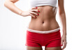 © Designpics - closeup of a good shaped woman's flat belly after or because of a good workout