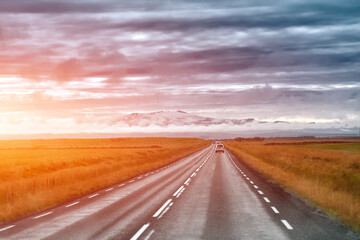 Canvas Print - Empty road leading to snow covered mountains, Beautiful landscape in early autumn of Iceland