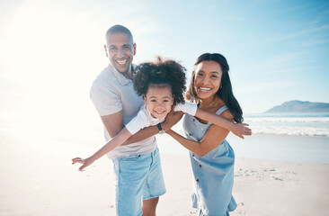 Canvas Print - Beach, portrait and parents flying their kid on the sand by the ocean on a family vacation. Happy, smile and girl child playing and bonding with her young mother and father on tropical summer holiday