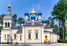 Church Of Our Lady Of Kazan Of The Mother Of God With Blue And Gold Domes In  Dzintari, Jurmala, Latvia. 