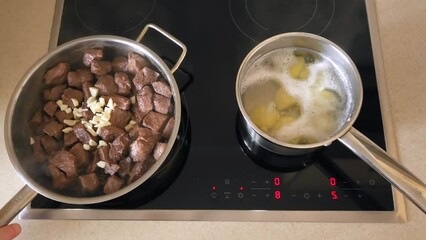 Wall Mural - Frying meat in a pan