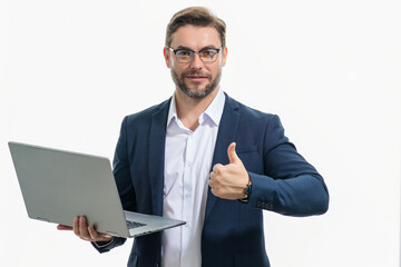Hispanic man working on laptop in studio. Business man in suit checking email on laptop, writing message in social network, using internet, searching information on laptops. Business man using laptop.