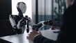 © Ilia - Man human sitting with robot behind the table, shaking hands, on job interview or negotiations with artificial intelligence. Cooperation, collaboration or partnership between human and robot concept.