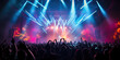 © JKLoma - An electrifying concert scene captured from the perspective of the audience, showcasing a packed medium - sized venue with a stage illuminated by bright lights.