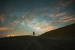 © ADDICTIVE STOCK - Silhouette of traveler standing and admiring starry sky during sunset time