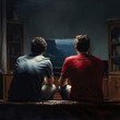 © LUPACO PNG - two men sitting on a bed watching television