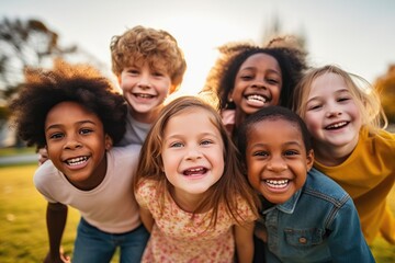 group of diverse cheerful fun happy multiethnic children outdoors at the schoolyard