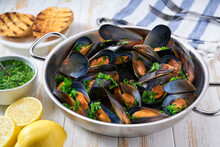 Traditional Boiled Seafood Mussels With Herbs And  Toasted Baguette.