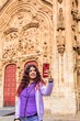 © Sangiao_Photography - Smartphone technology holiday vacation. Latin American mid-female. Lifestyle selfie in Salamanca.