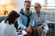 © ArtSys - Psychologist cabinet. Female professional therapist at the session with senior mature retired couple, discussing mental health problems, depression. Concept of support, family relationships