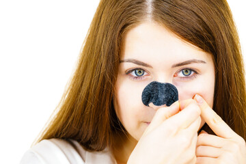 Wall Mural - Woman removing pore strips mask from nose