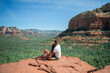 © travnikovstudio - Travel in Devil's Bridge Trail, scenic view panoramic landscape in Sedona, Arizona, USA. Happy Couple on the famous trail in Sedona