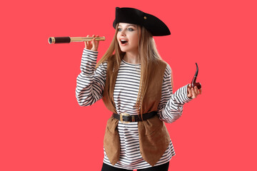 Beautiful female pirate with spyglass and smoking pipe on red background