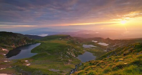 Wall Mural - sunrise above bulgarian mountain peaks, hills, seven rila lakes and clouds, 4k video nature of bulga