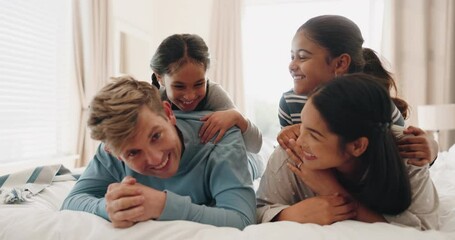 Poster - Bed, family and parents with girls, happy and playing on vacation, relax and quality time. Mother, father and female children in a bedroom, fun or cheerful with happiness, talking and loving together