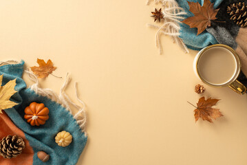 Capture essence of autumn from top view: coffee cup, warm scarf, small pumpkins, yellow maple leaves, pine cones, and anise on a pastel beige background. Plenty of space for text or advertisements