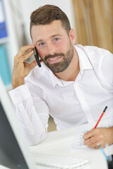 businessman shopping over the phone in an office