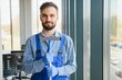 © Serhii - Young man cleaning window in office