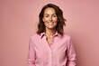 © igolaizola - portrait of smiling woman in pink shirt looking at camera isolated on pink background