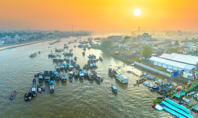 Cai Rang floating market, Can Tho, Vietnam, aerial view, sunrise background. Cai Rang is famous market in mekong delta, Vietnam.