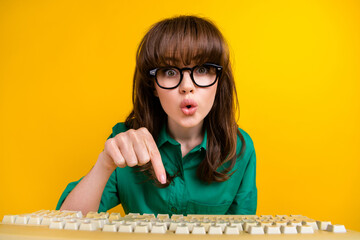 Canvas Print - Photo of funky shocked woman dressed green shirt communicating obsolete device isolated yellow color background