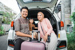 © Odua Images - happy asian muslim family going on road trip back home during eid mubarak celebration