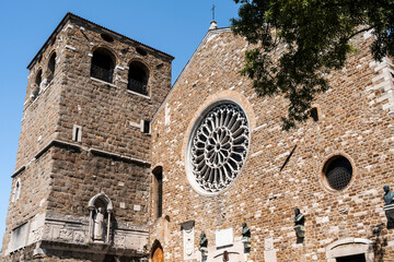 Wall Mural - The façade and the bell tower of San Giusto cathedral built in 14th century in Romanesque style, Trieste city center, Italy