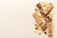 Various Granola Bars On Table Background. Cereal Granola Bars. Superfood Breakfast Bars With Oats, Nuts And Berries, Close Up. Superfood Concept