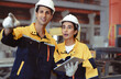 © Nassorn - Latino industrial engineer in white helmet and safety jacket work in heavy metal engineering factory. Technician worker team using tablet computer control metalwork in manufacturing facility, portrait