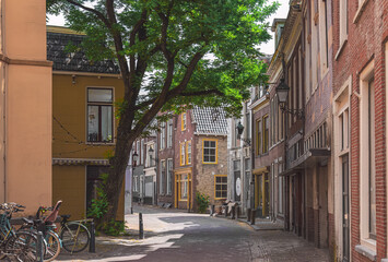 beautiful old street with brick houses in leeuwarden, netherlands