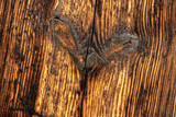 Fototapeta  - gnarled board in wooden door