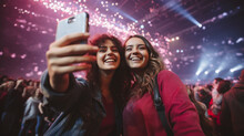 Selfie Image Of Two Young Women At A Concert In A Giant Indoor Arena