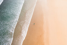 Aerial View Of A Surfer On Famara Beach, Lanzarote, Spain.