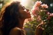 Leinwandbild Motiv beautiful woman smelling flowers in summer