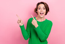 Photo Of Young Surprised Girl Wear Green Jumper Shocked Impressed Reaction Indicate Fingers Empty Space Isolated On Pink Color Background