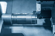 © Pixel_B - The  CNC lathe machine forming  cutting the metal shaft parts.