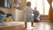 baby first steps. baby goes to her father at window learns to walk to take first steps. happy family kid dream concept. dad calls son baby first steps indoors. happy family lifestyle indoors concept