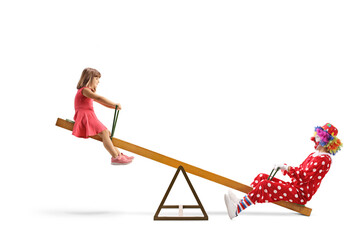 Wall Mural - Little girl playing on a seesaw with a clown