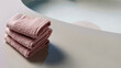 Rosa Handtücher auf der Theke schön gestapelt und Platzhalter für Werbefläche, ai generativ