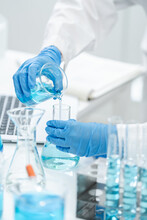 Medicine Research In Chemical Laboratory, Chemist Scientist Working With Liquid Experiment Test Analysis By Using Scientific Tube Beaker Glassware, Chemistry Science Pharmaceutical Medical Lab Concept