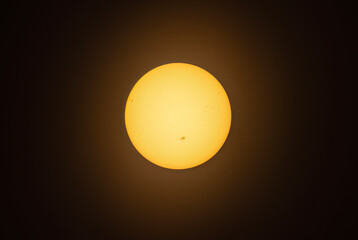 The afternoon sun glowing with many sunspots using a homemade solar filter
