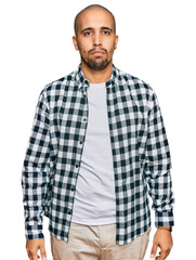 Canvas Print - Hispanic adult man wearing casual clothes depressed and worry for distress, crying angry and afraid. sad expression.