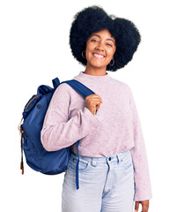 Canvas Print - Young african american girl holding student backpack looking positive and happy standing and smiling with a confident smile showing teeth