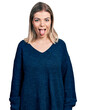© Krakenimages.com - Young blonde woman wearing casual sweater sticking tongue out happy with funny expression. emotion concept.
