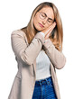 © Krakenimages.com - Young blonde woman wearing business shirt and glasses sleeping tired dreaming and posing with hands together while smiling with closed eyes.