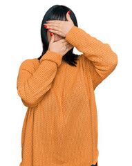 Poster - Young hispanic woman wearing casual clothes covering eyes and mouth with hands, surprised and shocked. hiding emotion