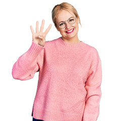 Canvas Print - Young blonde woman wearing casual clothes and glasses showing and pointing up with fingers number four while smiling confident and happy.